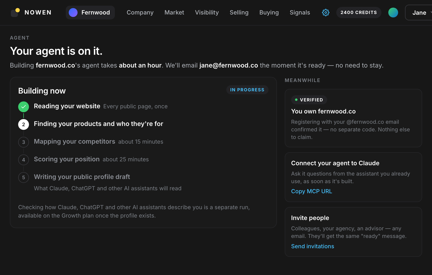 The "Your agent is on it" page showing the build phases in progress, with the domain marked Verified